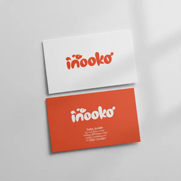 Realistic mockup of two business cards, front side in white with uploaded logo, back side in brand color with contact details. Slight overlap, soft natural light, clean background, professional and elegant look.