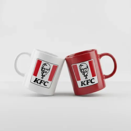 Two mugs leaning together, one white and one brand-colored, logo centered on both, solid background, realistic lighting and shadows, photorealistic ceramic texture.