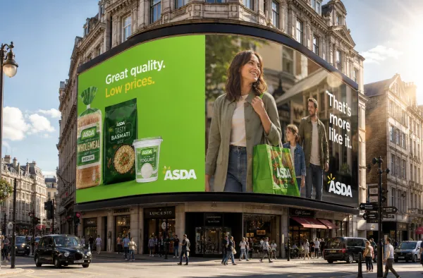 Create a professional outdoor urban advertising mockup based on the uploaded logo and brand assets.
Feature a large curved 3D LED billboard on a classic European-style building in a busy city square.
Split layout: one side shows a product photo, the other side a high-end lifestyle portrait with minimalist typography and brand logo.
The scene is sunlit with pedestrians, vehicles, and storefronts, creating a realistic, premium metropolitan atmosphere.
Automatically adapt all colors, imagery, text, and logos to match the uploaded brand identity.