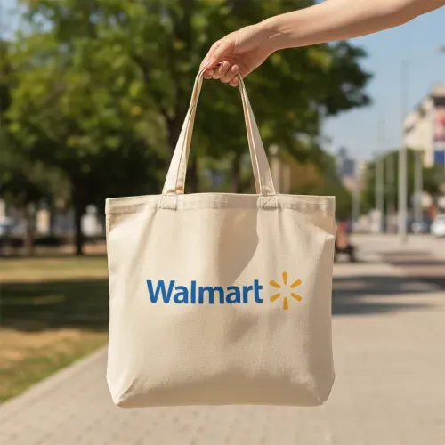 A realistic canvas tote bag mockup being held by a hand outdoors, the uploaded logo clearly visible on the bag, natural sunlight, soft shadows, realistic texture of canvas, park or street background, photorealistic, high detail.
